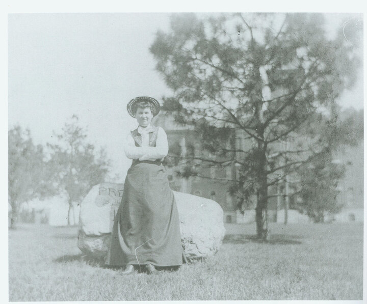 Willa Cather sits on a large rock in what is now Sheldon Sculpture Garden